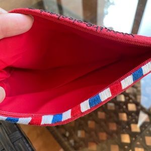 Cute little, red, zipper pouch. Brand new w/tag. 100% linen.